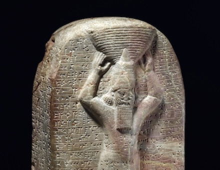 Stone stela of Ashurbanipal inscribed with cuneiform commemorating his building work on the Temple of Marduk in Babylon. Trustees of the British Museum.
