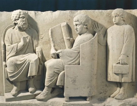 Relief from a burial monument showing a teacher and students, Neumagen, Germany, c.AD 180. G. Dagli Orti/NPL - DeA Picture Library/Bridgeman Images.