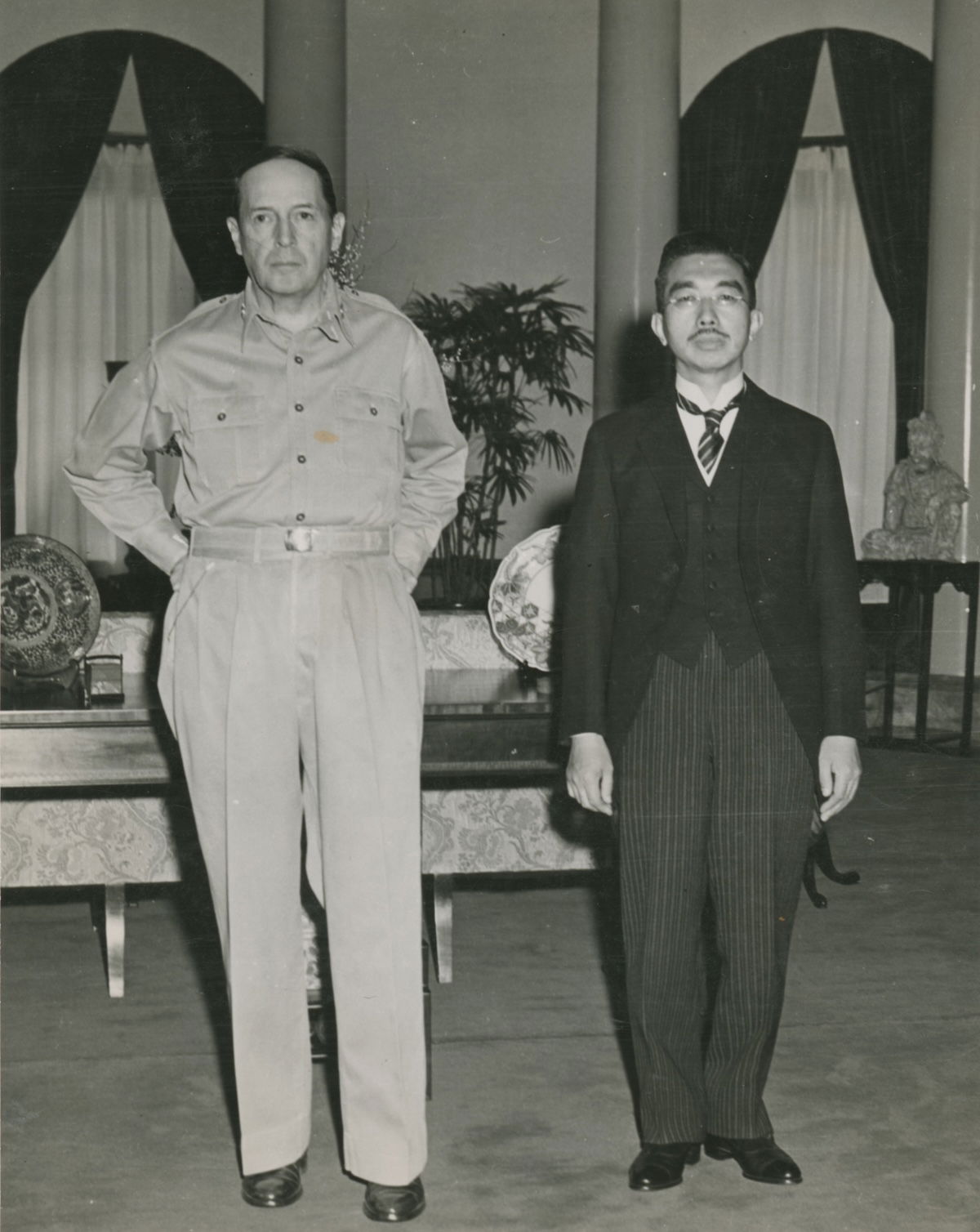 General Douglas MacArthur and Emperor Hirohito at the US embassy in Tokyo, 27 September 1945. NARA. Public Domain.