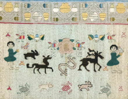 Martha Collymore’s sampler, detail showing her inscription (bottom) below the rose flanked by birds, Barbados, 1771. Royal School of Needlework.